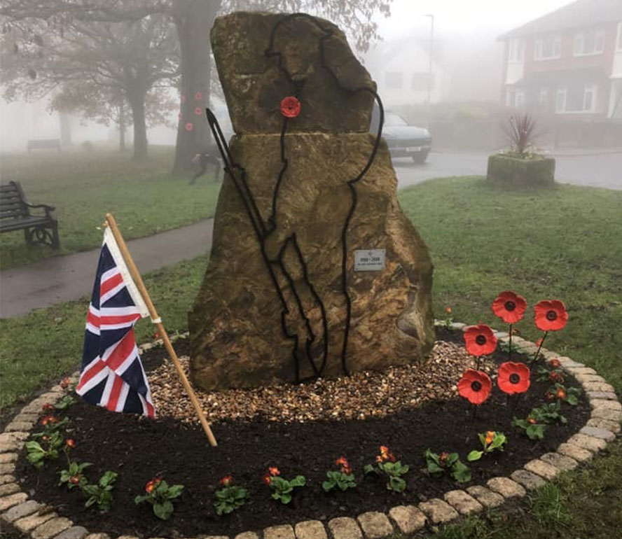 rememberance stone poppies union jack cloudy