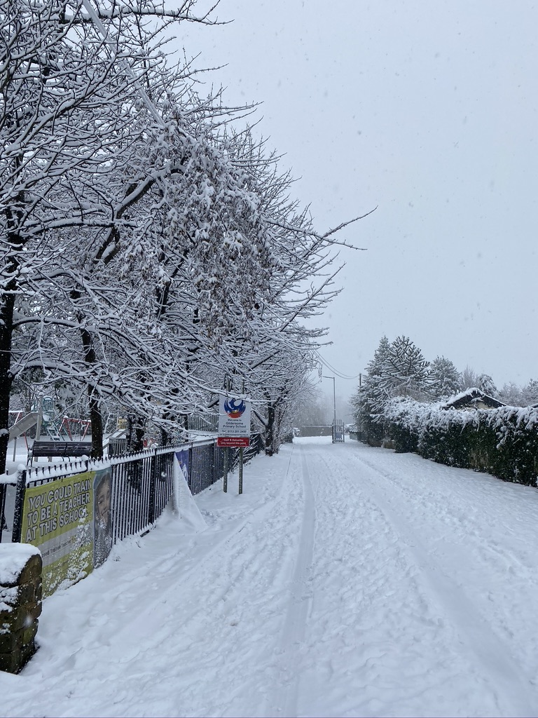 The drive way leading to Gildersome Primary School covered in snow